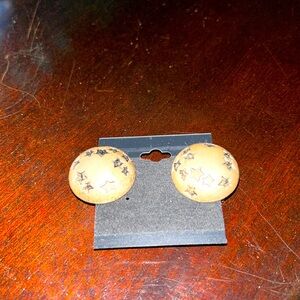 Vintage pierced half dome earrings. Black stars on gold